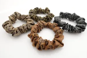 a set of 4 thin faux leather scrunchies stylish hair tie ponytail holder pack for women